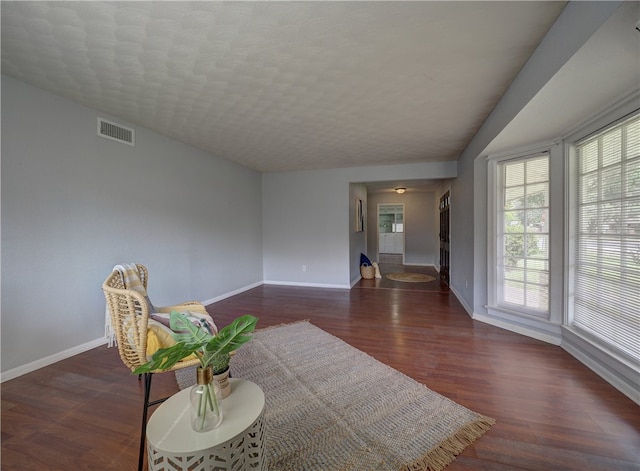 living area with dark hardwood / wood-style flooring