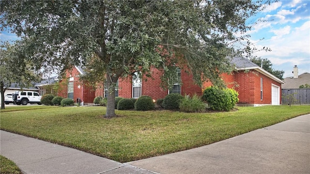 view of side of property with a yard