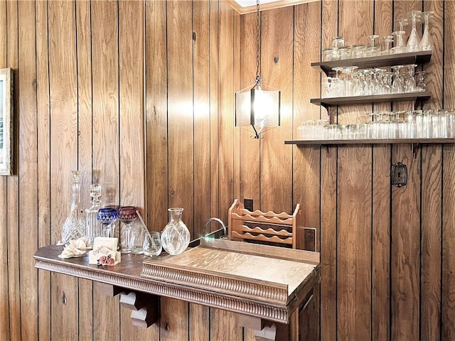 interior space with a bar and wood walls