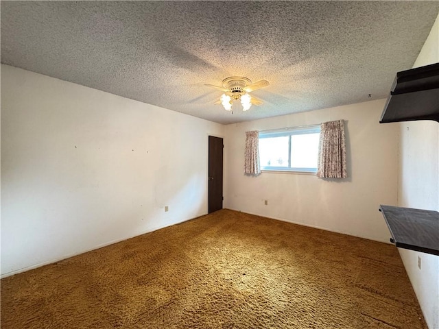 unfurnished bedroom featuring carpet, a ceiling fan, and a textured ceiling