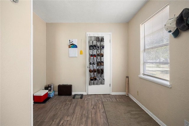 1009 E Sinton St, Sinton, TX 78387 - spare room featuring wood finished floors and baseboards