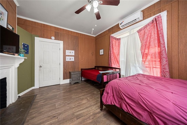 1009 E Sinton St, Sinton, TX 78387 - bedroom featuring a wall mounted AC, crown molding, a fireplace, wood walls, and wood finished floors