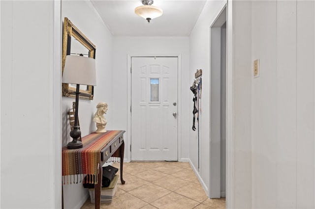 doorway featuring light tile patterned flooring