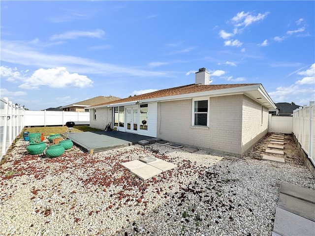 back of property featuring a patio