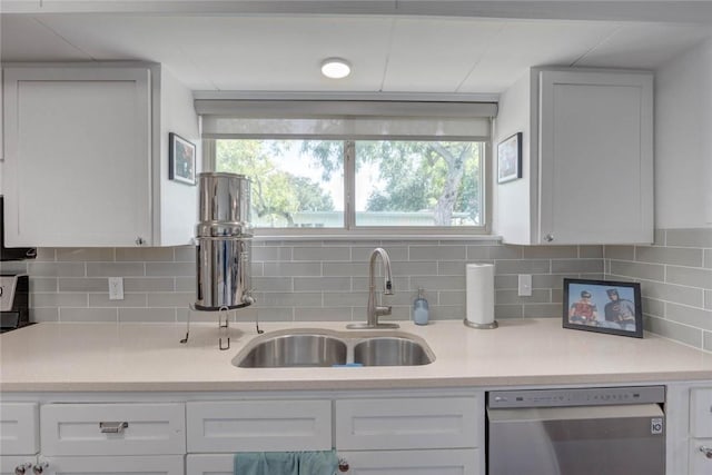 239 Purl Pl, Corpus Christi, TX 78412 - kitchen with stainless steel dishwasher, light countertops, and backsplash