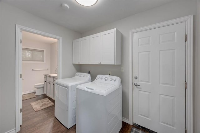239 Purl Pl, Corpus Christi, TX 78412 - laundry area featuring cabinet space, independent washer and dryer, and dark wood finished floors