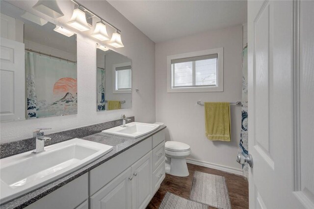 239 Purl Pl, Corpus Christi, TX 78412 - bathroom featuring wood finished floors and double vanity