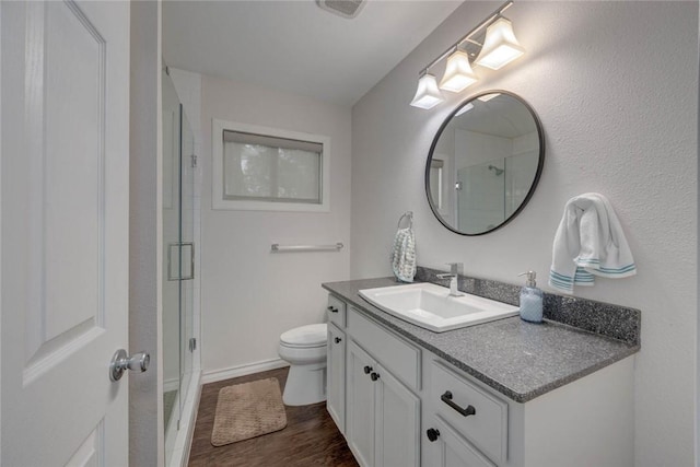 239 Purl Pl, Corpus Christi, TX 78412 - full bathroom featuring vanity, a shower with shower door, and wood finished floors