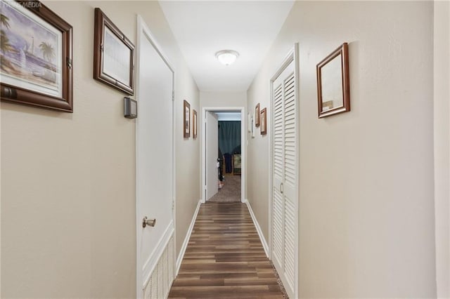 hallway featuring dark hardwood / wood-style floors