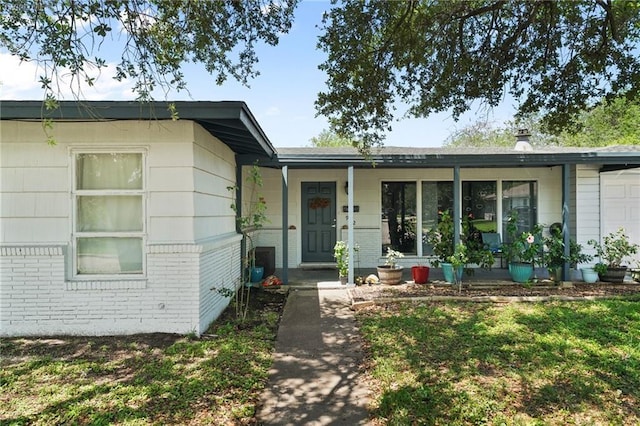 exterior space featuring a porch and a yard