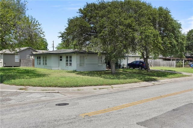 ranch-style house with a front yard