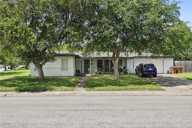 ranch-style house featuring a garage