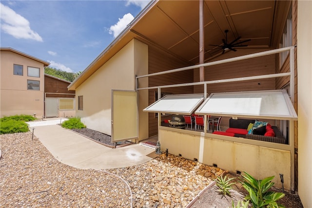 view of side of home featuring a patio