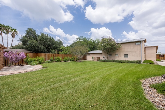 view of yard with a patio area