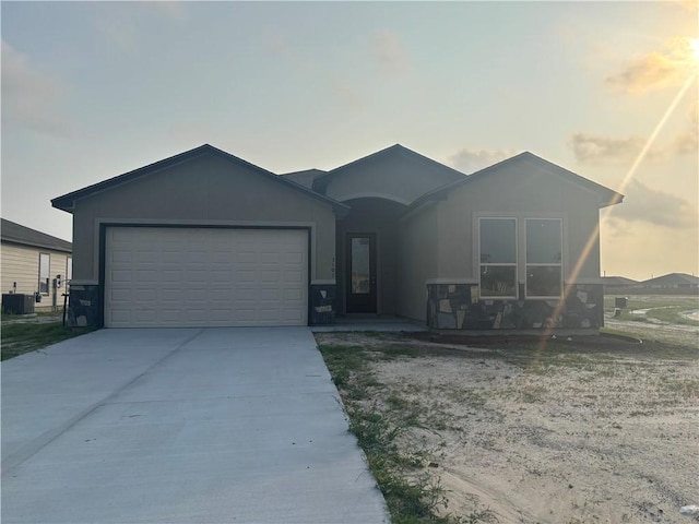 3101 Adak Ct, Corpus Christi, TX 78414 - ranch-style house featuring a garage, concrete driveway, and cooling unit