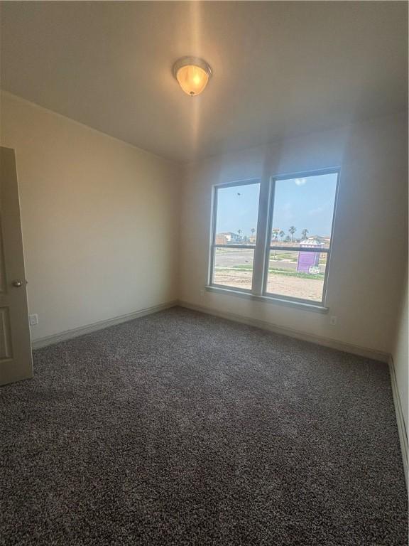 3101 Adak Ct, Corpus Christi, TX 78414 - empty room with carpet floors and baseboards