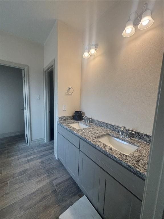 3101 Adak Ct, Corpus Christi, TX 78414 - full bathroom with double vanity and wood finished floors