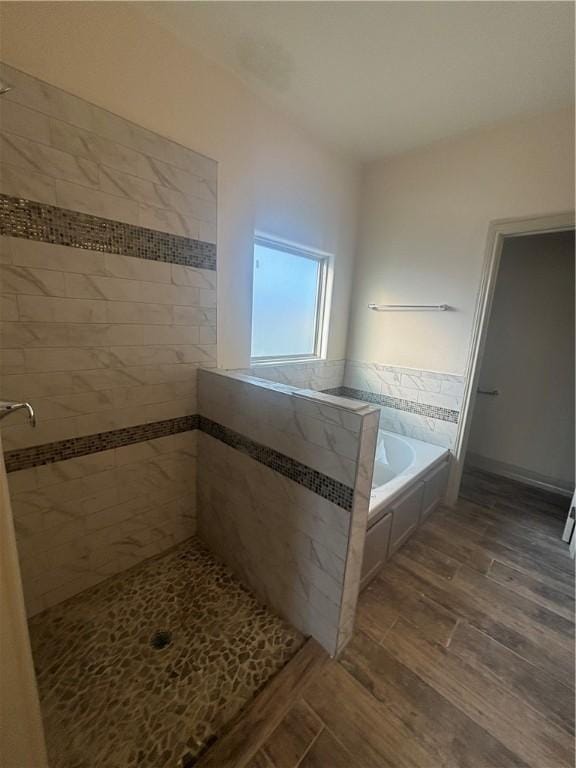 3101 Adak Ct, Corpus Christi, TX 78414 - bathroom with a garden tub, tiled shower, and wood finished floors