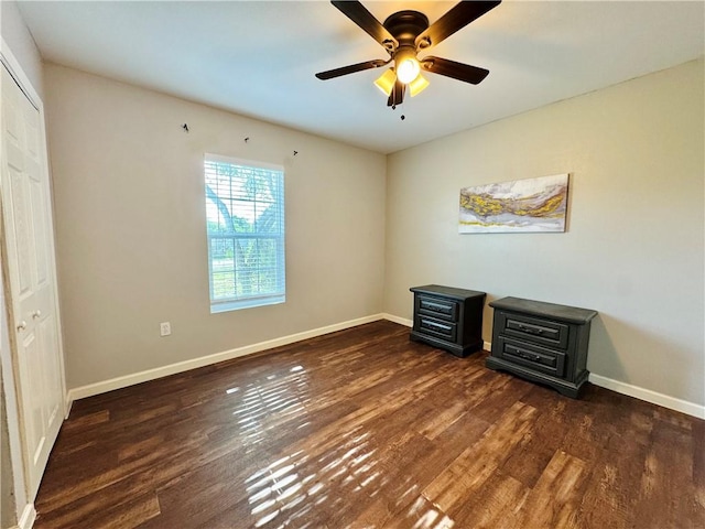 2514 Dwyer Dr, Corpus Christi, TX 78410 - unfurnished bedroom with a wood stove, wood finished floors, and ceiling fan
