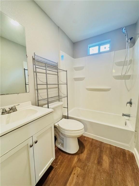 2514 Dwyer Dr, Corpus Christi, TX 78410 - full bathroom featuring vanity, wood finished floors, and tub / shower combination