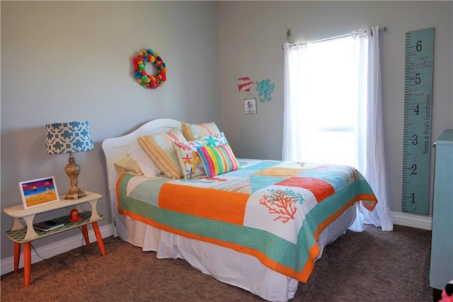 carpeted bedroom with baseboards