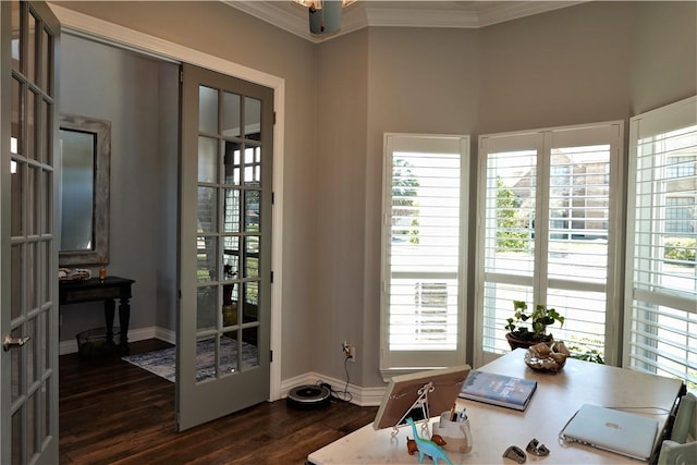 dining room with dark wood finished floors, crown molding, french doors, and baseboards