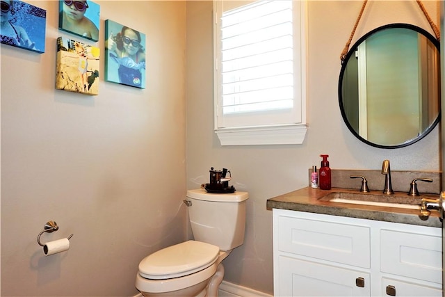 half bath with vanity and toilet