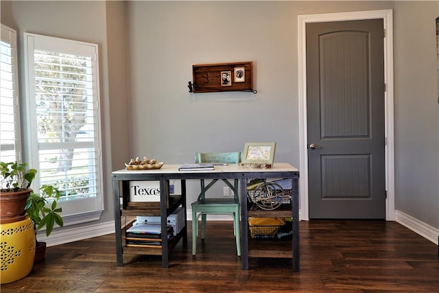 office space featuring dark wood-style floors and baseboards