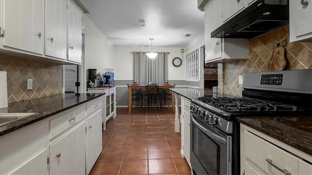 5301 Bromley Dr, Corpus Christi, TX 78413 - kitchen featuring gas range, under cabinet range hood, tasteful backsplash, white cabinetry, and tile patterned floors