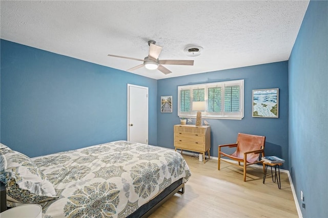 6622 Pharaoh Dr, Corpus Christi, TX 78412 - bedroom featuring wood finished floors, a textured ceiling, and ceiling fan