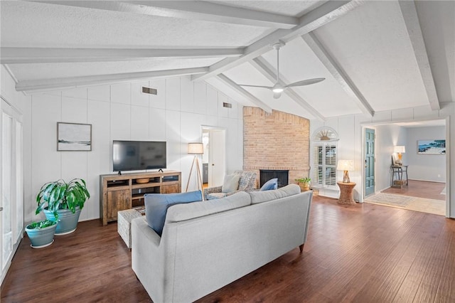 6622 Pharaoh Dr, Corpus Christi, TX 78412 - living room with dark wood finished floors, a ceiling fan, and a fireplace