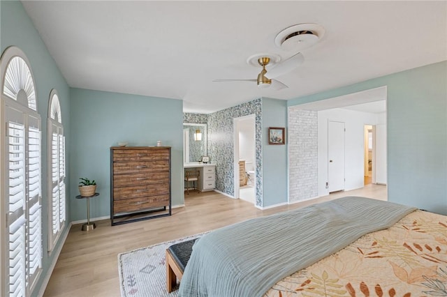 6622 Pharaoh Dr, Corpus Christi, TX 78412 - bedroom with wood finished floors, connected bathroom, and a ceiling fan