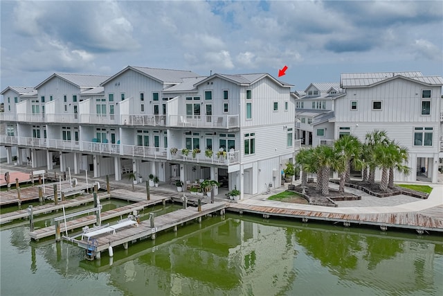 exterior space featuring a water view and a balcony