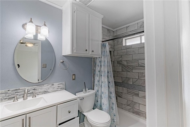 bathroom with toilet, tiled shower, visible vents, and vanity