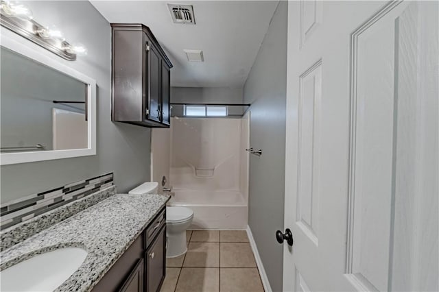 bathroom featuring visible vents, toilet, tub / shower combination, vanity, and tile patterned flooring