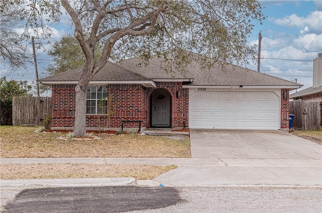 ranch-style home with a garage, brick siding, fence, and driveway