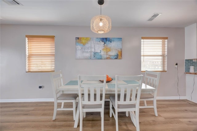 521 Woodhaven, Ingleside, TX 78362 - dining space with light wood-style floors and baseboards