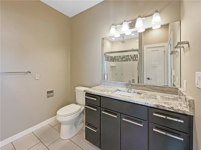 bathroom featuring vanity, walk in shower, tile patterned flooring, and toilet