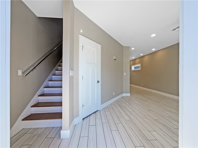 stairway featuring hardwood / wood-style flooring