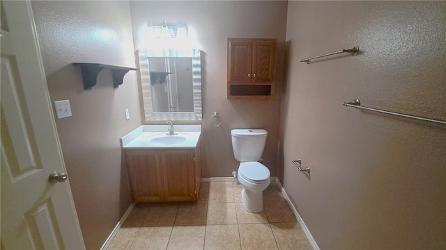 2906 Alice Ln, Kingsville, TX 78363 - bathroom with tile patterned flooring, toilet, vanity, and baseboards