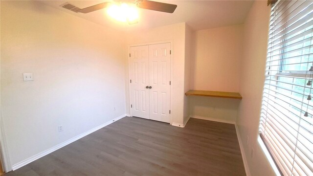 2906 Alice Ln, Kingsville, TX 78363 - unfurnished room featuring a ceiling fan, baseboards, and dark wood finished floors