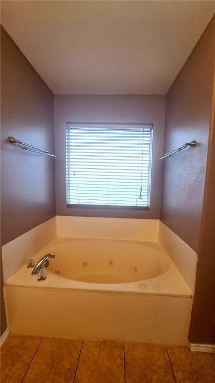 2906 Alice Ln, Kingsville, TX 78363 - full bath featuring a tub with jets, a healthy amount of sunlight, and tile patterned flooring