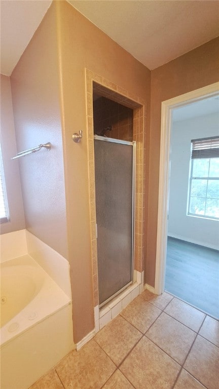 2906 Alice Ln, Kingsville, TX 78363 - full bathroom with a shower stall, a garden tub, and tile patterned flooring