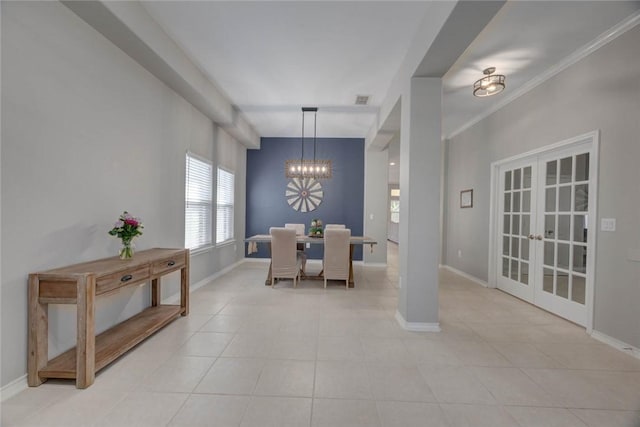 7522 Bell Isle, Corpus Christi, TX 78414 - dining room featuring a chandelier, french doors, light tile patterned floors, and baseboards