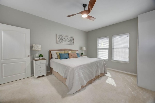 7522 Bell Isle, Corpus Christi, TX 78414 - bedroom featuring light carpet, baseboards, and a ceiling fan