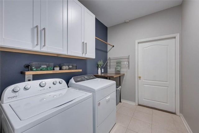 7522 Bell Isle, Corpus Christi, TX 78414 - laundry area with cabinet space, washing machine and clothes dryer, baseboards, and light tile patterned flooring