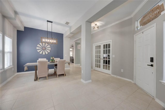7522 Bell Isle, Corpus Christi, TX 78414 - dining area with a chandelier, light tile patterned flooring, baseboards, and ornamental molding