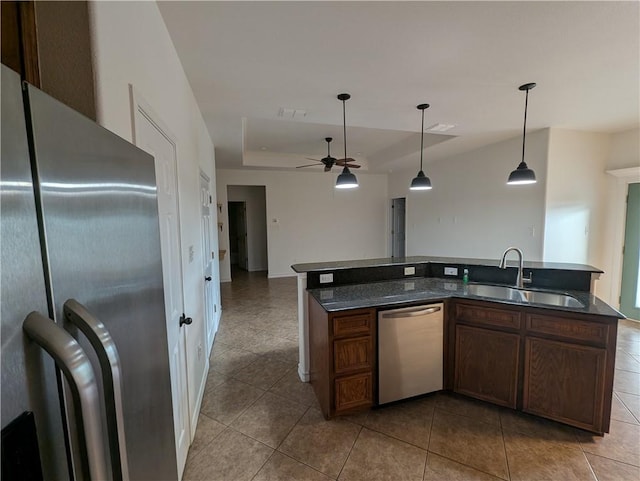 2905 Dante Dr, Corpus Christi, TX 78415 - kitchen with appliances with stainless steel finishes, a raised ceiling, tile patterned flooring, a ceiling fan, and pendant lighting