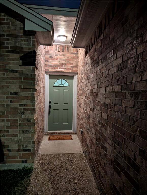 2905 Dante Dr, Corpus Christi, TX 78415 - view of exterior entry featuring brick siding
