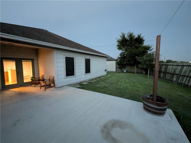 2905 Dante Dr, Corpus Christi, TX 78415 - fenced backyard featuring a patio and french doors